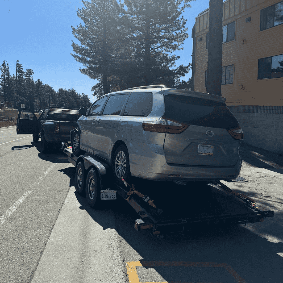 Towing truck in the snow in Mammoth Lakes, CA