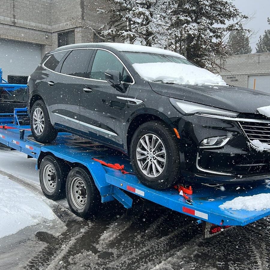 Towing truck in the snow in Mammoth Lakes, CA