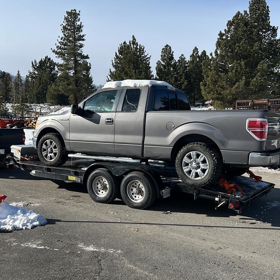 Towing truck in the snow in Mammoth Lakes, CA