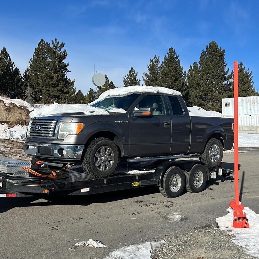 Towing truck in the snow in Mammoth Lakes, CA